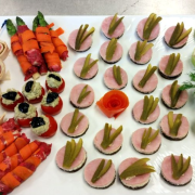 Amuse-bouche platter (antipasto pinwheel, beef-wrapped asparagus, stuffed tomatoes, canapes, cucumber cups with crab salad and shrimp garnish